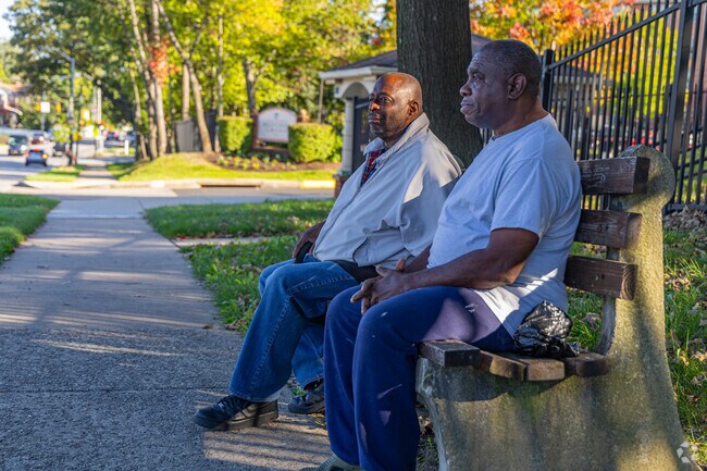 Residents can comfortably wait on benches for their bus to arrive.