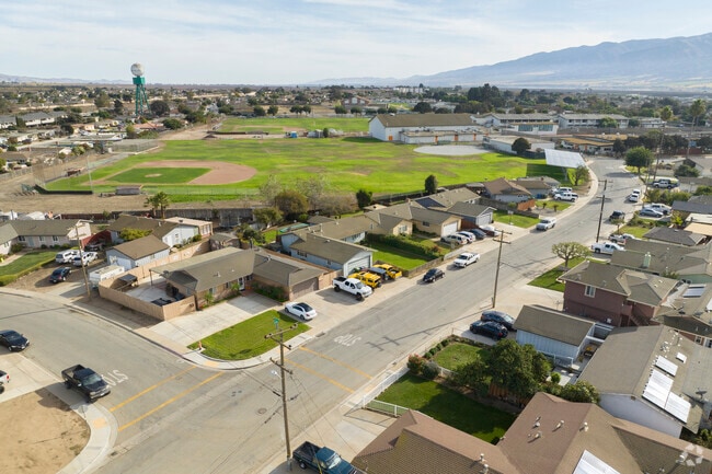 A row of homes and a baseball field in Gonzales, California.