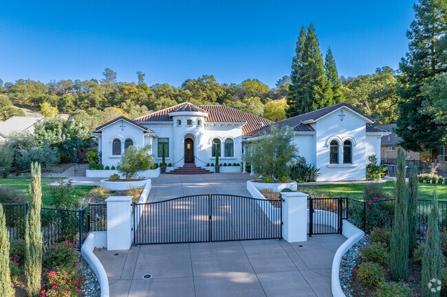 A mission style home tucked up against a hill in the Clover Valley Woods neighborhood.