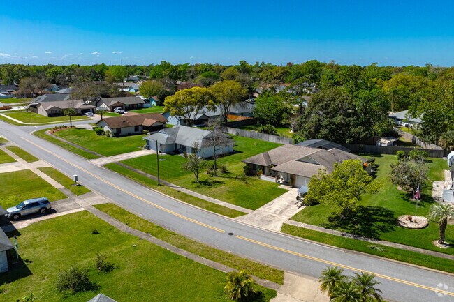 This row of homes in Foxboro features neatly manicured and spacious lawns.