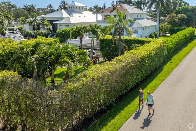 People in Royal Harbor stroll the quiet streets enjoying the Florida sunshine.