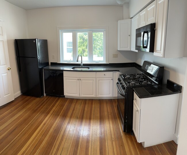 Updated kitchen. All stainless steel appliances, Brazilian granite countertop, Shaker cabinets