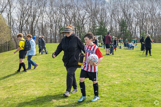 Hillside park gathers many families around Boylston for a fun soccer game on a Saturday.