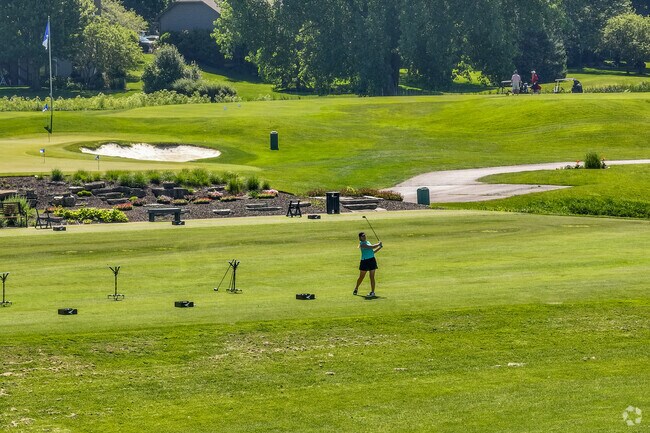 Eagle Brook residents use the driving range at the Country Club close by.