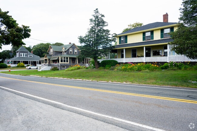 A peaceful street near Monument Beach is dotted with unique homes.