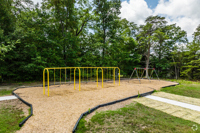 Students can reach for the sky on the swingset of Plain Elementary.