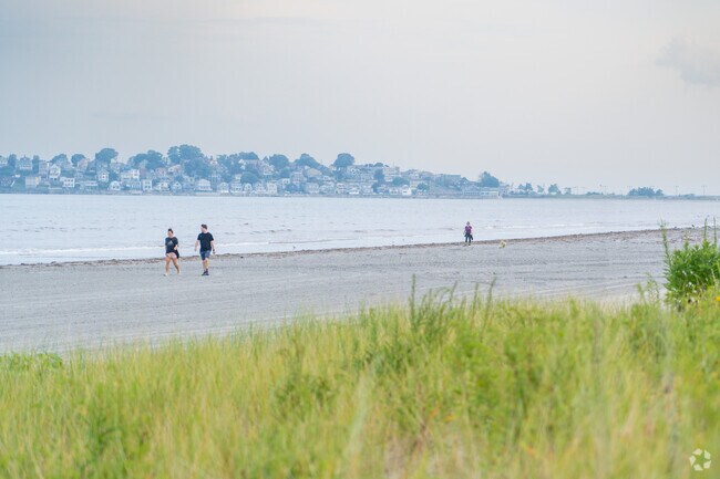 Residents enjoy walks along the beach by Nahant Bay near Lower Broadway.