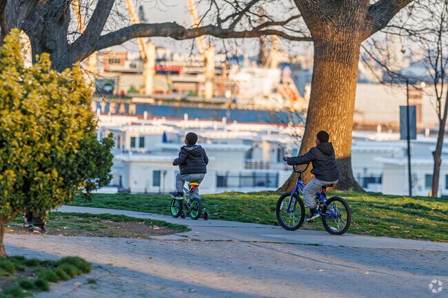 Kids play at sunset in Federal Hill Park, next to Sharp-Leadenhall.