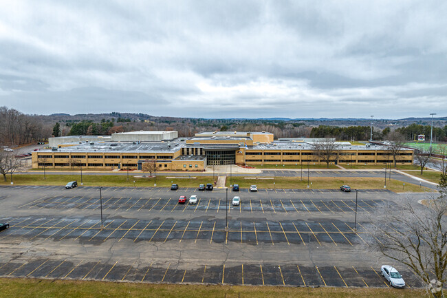 Menomonie High School has a large parking lot in front of the school.