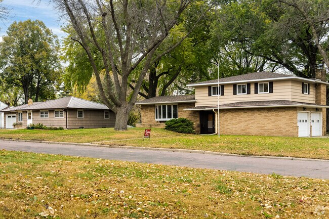 Homes from the early to mid 1900s sit in the shade of mature trees in St. James.