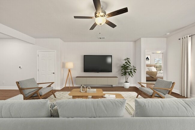 Living room with large window letting in a ton of natural light.