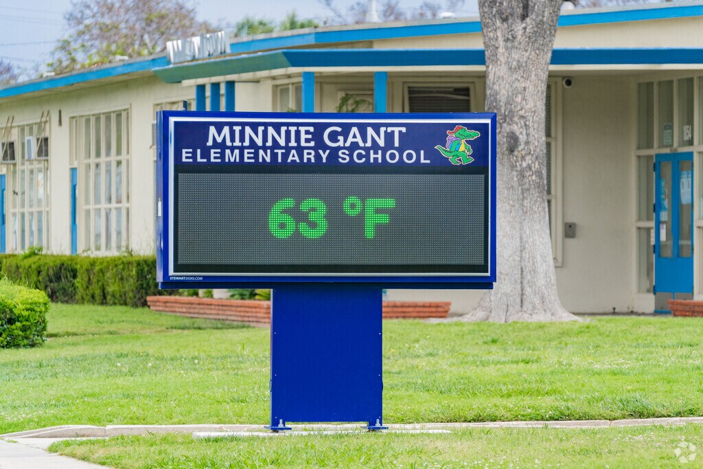 The Minnie Gant Elementary School sign displays announcements.