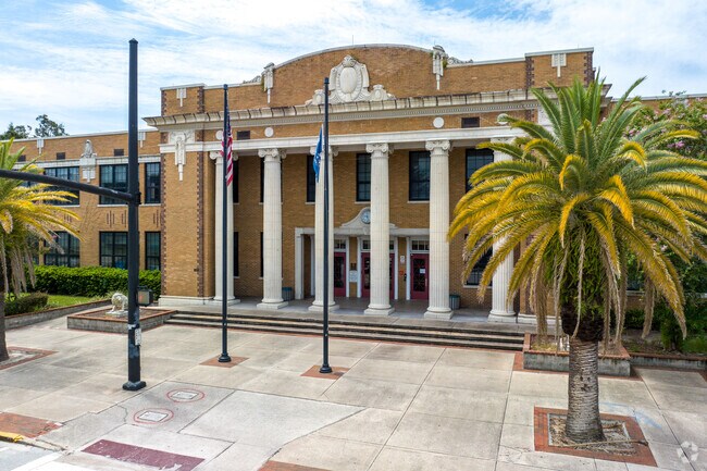 Howard Middle School, known for its Classical Revival style, has a large prominent entrance.