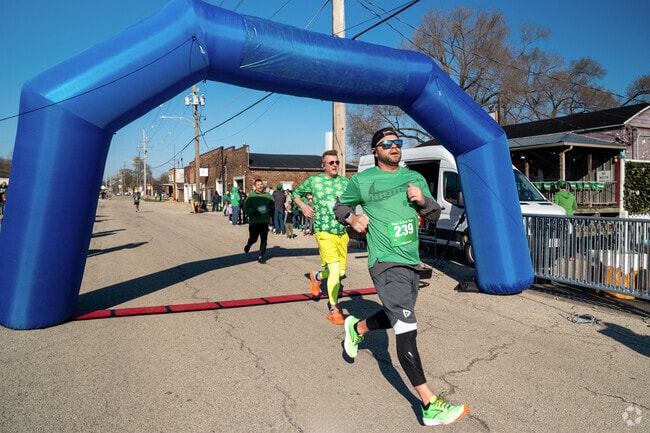 Two racers cross the finish line at nearby Yorkville's RUN S.O.B. RUN 5k.