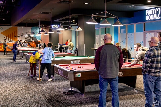 Locals enjoy playing some billiards at the Round 1 in nearby New Cassel.