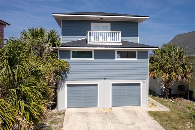 A Typical Two-Story Home Cwith two car garage is close to the Beach in Vilano Beach, FL.