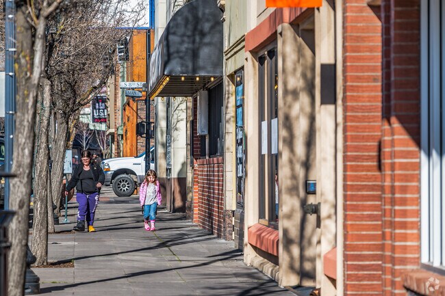 A mom and daughter are shopping the brick building lined Main Street in Klamath Falls.