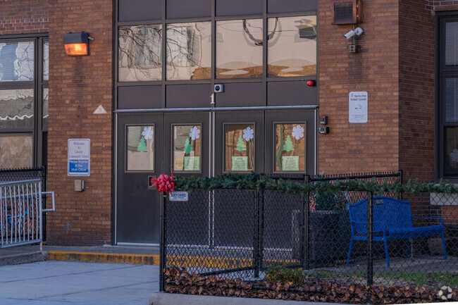 The front entrance to Lincoln community school is modestly decorated with holiday ornaments.