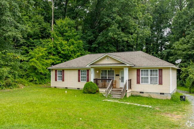 Homes in Wilson Heights are hidden among the dense old growth trees and vegetation of the area.