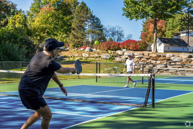 A couple plays pickleball on the courts at Sky Meadow Country Club in Southwest Nashua.