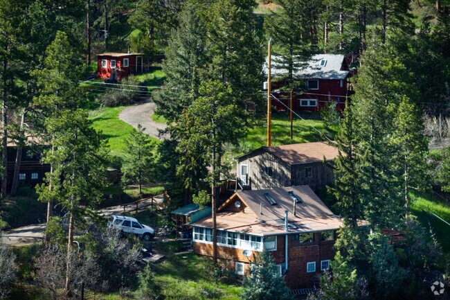 A group of cabin-style homes are built along the winding roads of Indian Hills.