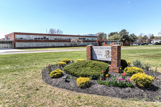 Signage shows proudly for all visitors at the main entrance in Central Islip.