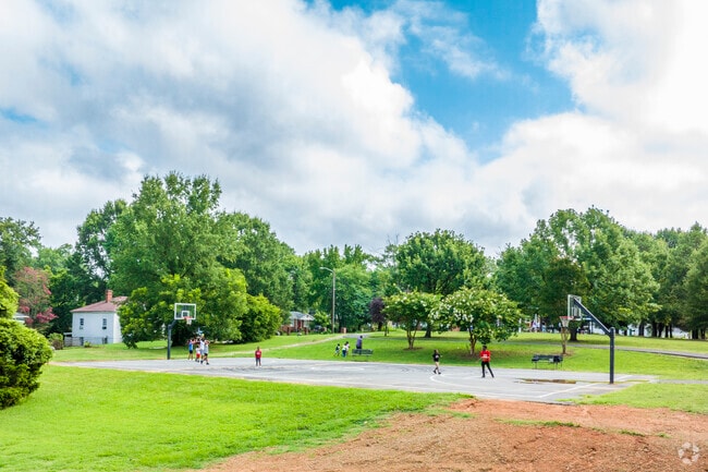 Kids from the Thomasboro-Hoskins neighborhood play basketball at Eva B. Barber Neighborhood Park