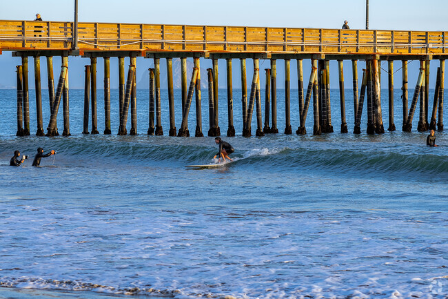 Catch the waves near the pier at Cayucos State Beach.