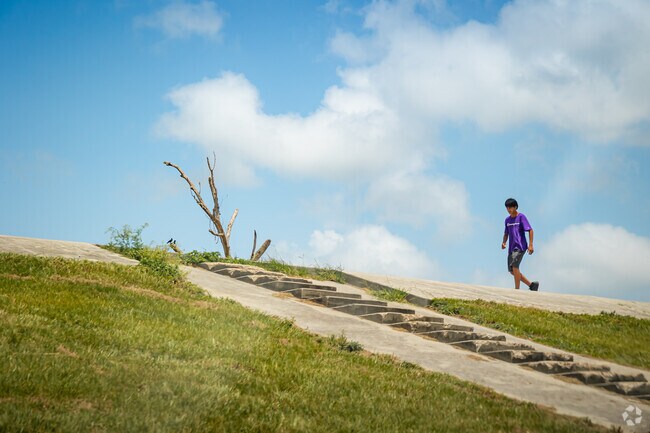 1111New Aurora residents walk the paths along the river.