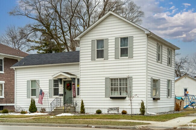 Colonial Farmhouse style home stands out in Heritage Square.