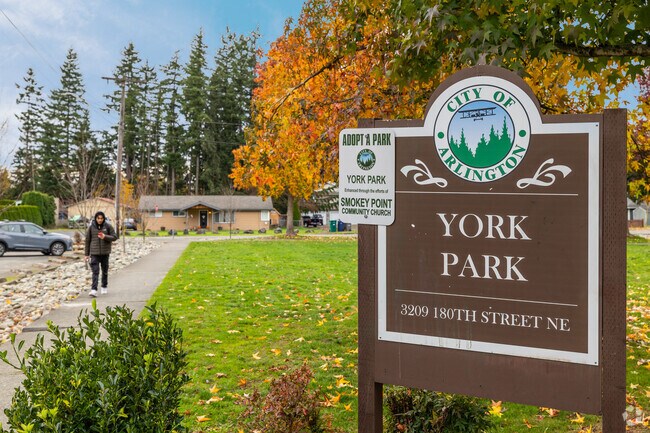 Families enjoy a playground and basketball court at J. Rudy York Memorial Park in Smokey Point.