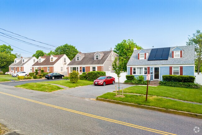 Here is a row of cute Cape Cod homes right near the Greenlawn train stop.