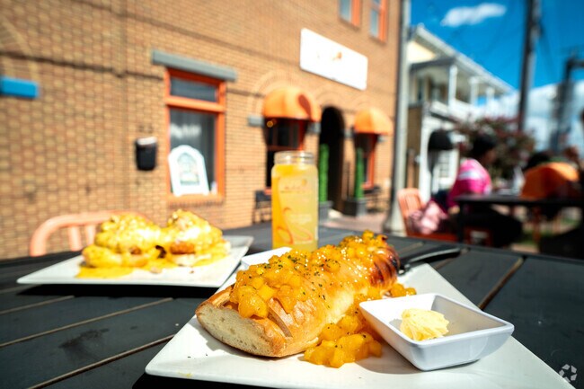 You can find Mango Mangeaux's famous Mango Presserve infused with most of their dishes.