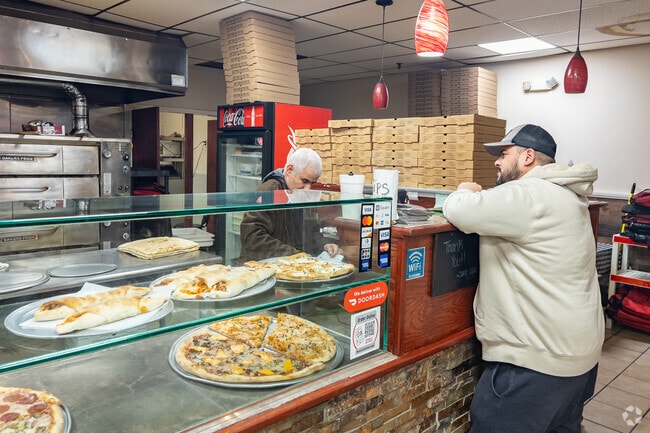 Enjoy a fresh slice at Nunzio's Pizza.