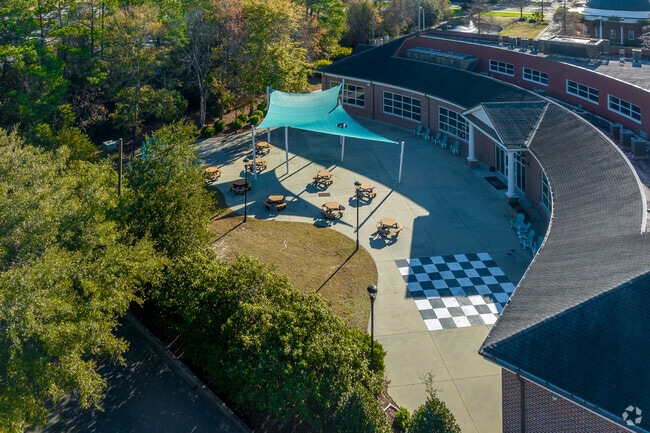 Hcs Scholars Academy High School has outdoor activity areas for students.
