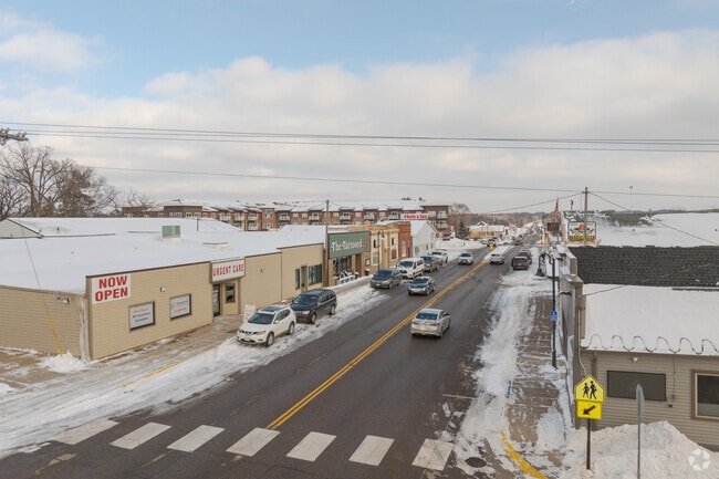 Downtown Zimmerman, Minnesota, featuring small-town shops and a snowy streetscape just 40 miles north of Minneapolis.