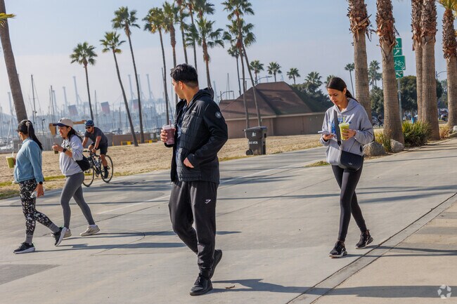 Taking a stroll on Shoreline Way with the Queen Mary in the background.