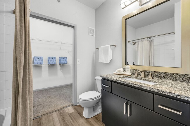Two Bedroom - Bathroom with framed mirror and rainfall shower head