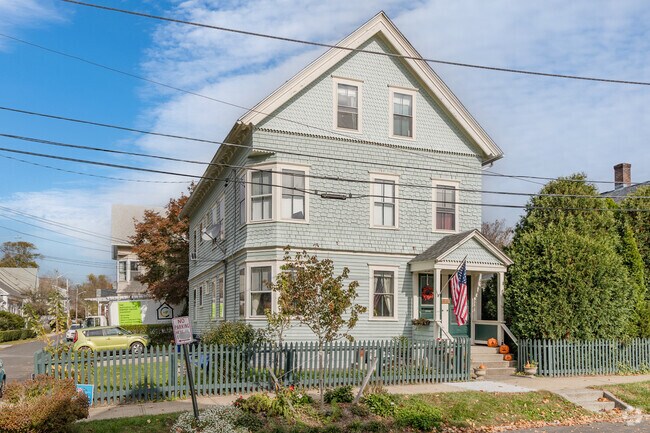 This large 2-family home in Downtown Bristol has elegant shingle-work with different patterns.