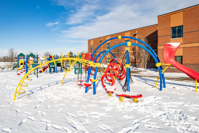 Reagan Elementary School has lots of p0layground equipment.