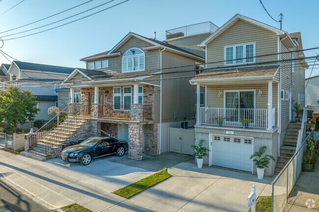 Most of the tree-lined streets in New Dorp Beach feature single-family homes of tan and brick.