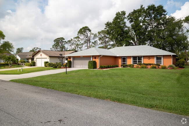 Ranch style homes with two car garages are common in the communities of the Council neighborhood in Bonita Springs, Florida.