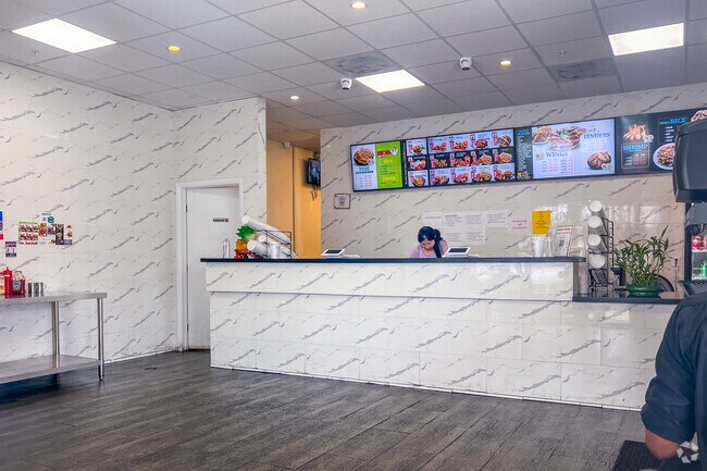 Interior of Miamis Best Wings offering various styled of wings, shrimp and more.