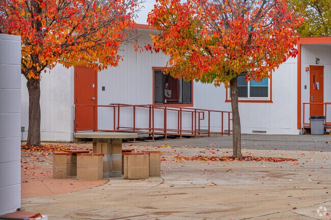 Concrete benches and table sit in the center of Adelante High (Continuation) School.