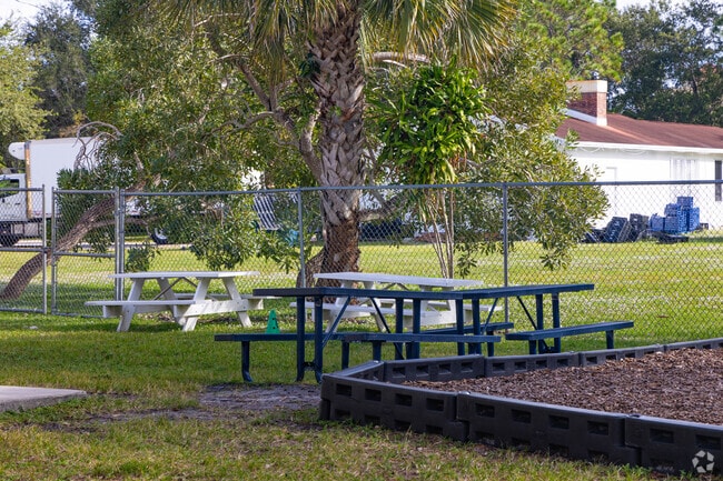 West Palm Beach Jr Academy offers outdoor seating for the students in the playground area.