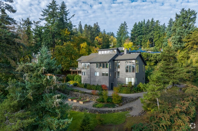 Floor to ceiling windows add breathtaking views to a home on S Military Rd in Dunthorpe.