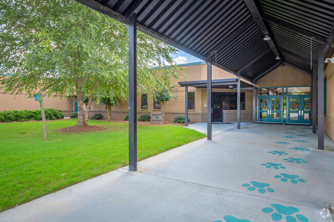 The entrance of Sharon Elementary School welcomes students.