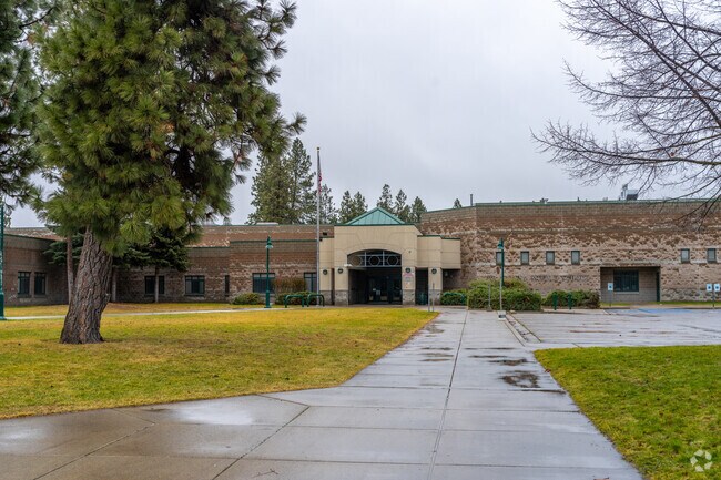 Woodlands Middle School features a large parking lot in front of the school.