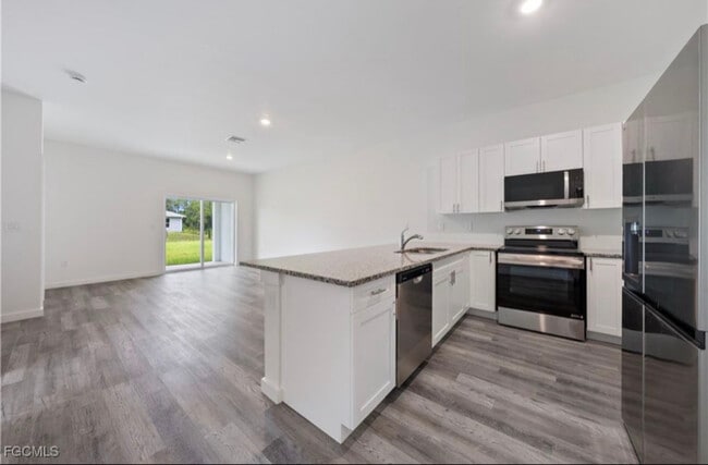 1027 Meadow Rd, Lehigh Acres, FL 33973 - photo 2