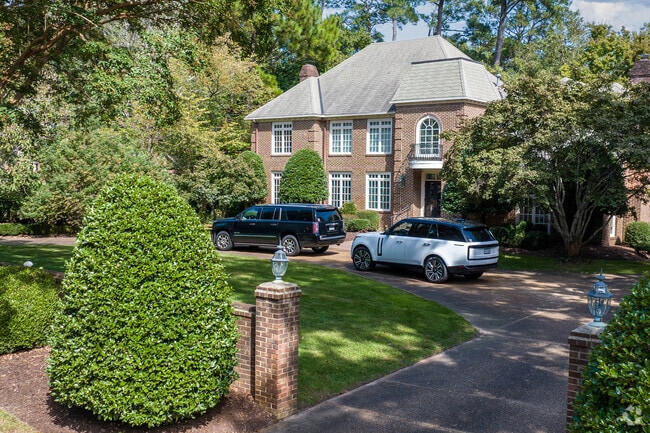 A brick Tudor-style home in Linkhorn Park showcases classic architecture and upscale finishes.